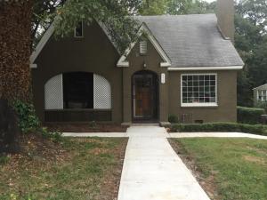 a brown house with a sidewalk leading to the front door at Magnificent Place-Moreland in Atlanta