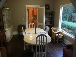 a dining room with a table and chairs and a window at Magnificent Place-Moreland in Atlanta