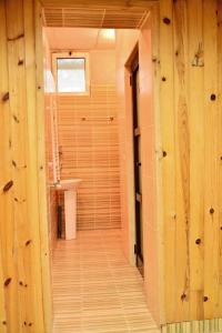 a bathroom with a toilet and a sink in a room at Olymp Hotel in Bansko