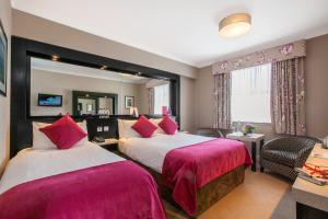 Cama ou camas em um quarto em Ashling Hotel Dublin