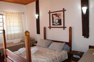 Postel nebo postele na pokoji v ubytování Encanto Rural