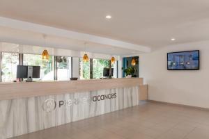 a restaurant with a counter in a room at Aparthotel Pierre & Vacances Mallorca Cecilia in Portocolom