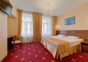 Ένα ή περισσότερα κρεβάτια σε δωμάτιο στο Agni Club Hotel
