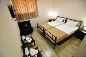 Letto o letti in una camera di Light Hotel