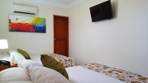 TV a/nebo společenská místnost v ubytování Hotel San Miguel Imperial