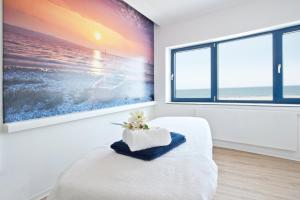 A bed or beds in a room at aja Warnemünde