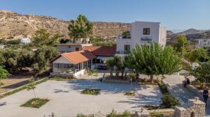 an aerial view of a house with a courtyard at Paradise Matala Hotel in Matala