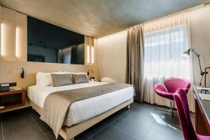 Кровать или кровати в номере Hotel Metropolis