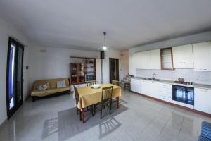 A kitchen or kitchenette at ARIES Case Vacanza