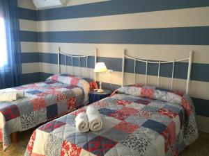 Un pat sau paturi într-o cameră la Casa Rural Casa Juli