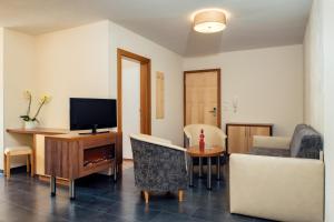 TV a/nebo společenská místnost v ubytování Apart Sunshine