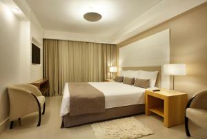 
Cama ou camas em um quarto em Royal Rio Palace Hotel
