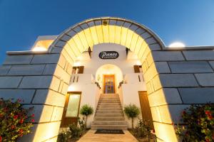an entrance to a building with a stairway at Panos Luxury Studios in Parikia