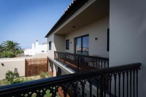 a balcony of a house with a view at Volcanic Charming House in Ribeira Grande