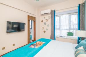 Säng eller sängar i ett rum på Zhengzhou Jinshui·North Third Ring Road International Trade Center· Locals Apartment 00163170