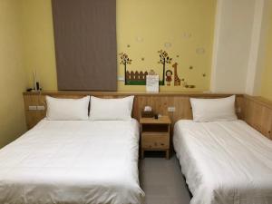 Tempat tidur dalam kamar di Com Inn-花蓮後車站電梯停車場