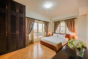 Postel nebo postele na pokoji v ubytování City View Apartment + 36 fotografií