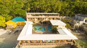an aerial view of a resort with a swimming pool at GingGing Hotel And Resort in Oslob