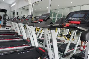 a row of treadmills in a gym at Valee home & food in Nakhon Nayok