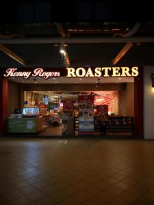a store with a sign that reads happy flyers roasters at Luxury Homestay at Puteri Harbour with Seaview in Nusajaya