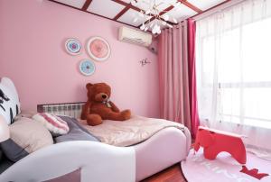 Ein Bett oder Betten in einem Zimmer der Unterkunft NanJing GuLou·Lion Bridge· Locals Apartment 00152470