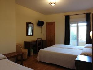 A bed or beds in a room at Labella María