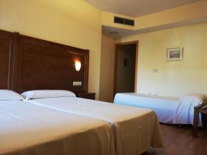 A bed or beds in a room at Labella María