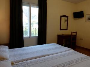 A bed or beds in a room at Labella María