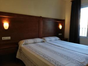 A bed or beds in a room at Labella María