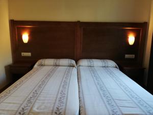 A bed or beds in a room at Labella María