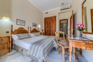 Postel nebo postele na pokoji v ubytování Hotel La Española