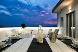 a dining room with a view of the ocean at Heaven House in Sant'Egidio del Monte Albino