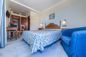 Postel nebo postele na pokoji v ubytování Hotel La Española