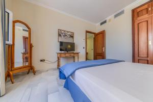 Postel nebo postele na pokoji v ubytování Hotel La Española