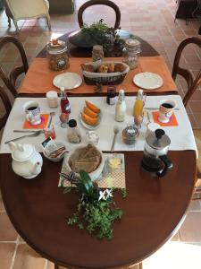 a wooden table with food on top of it at Kericouette et Délices in Le Vieux-Bourg +9 photos
