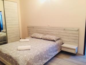 Postel nebo postele na pokoji v ubytování Apartment Soho Tabidze