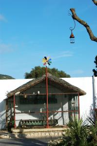 a building with a windmill in front of it at Residencial La Teja in Zahora