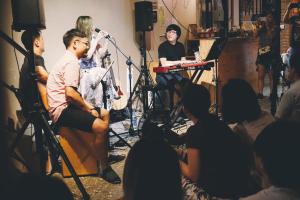 a group of people sitting in a recording studio at 62巷背包客棧 Lane62 Hostel in Longjing