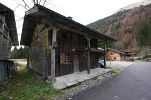 an old wooden building on the side of a road at Chalet Marion in Montriond