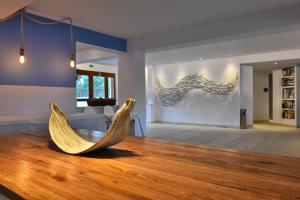 a hammock in the middle of a living room at Hotel Korali in Troulos