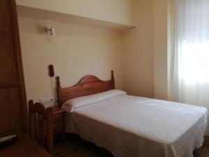A bed or beds in a room at Labella María
