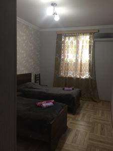 Postel nebo postele na pokoji v ubytování Guest house Maspindzeli