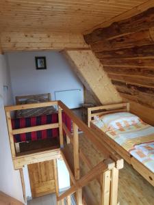 an overhead view of two bunk beds in a attic at Casa Veves in Ranca