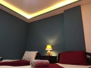 Postel nebo postele na pokoji v ubytování Nobel Hotel
