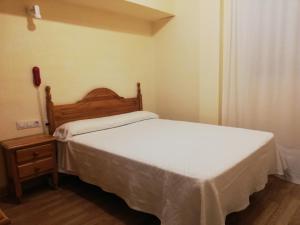 A bed or beds in a room at Labella María