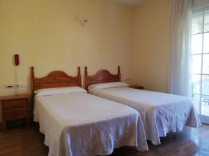 A bed or beds in a room at Labella María