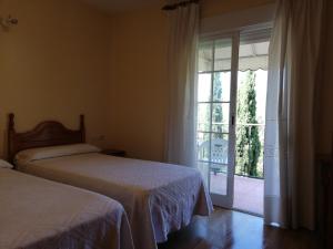 A bed or beds in a room at Labella María