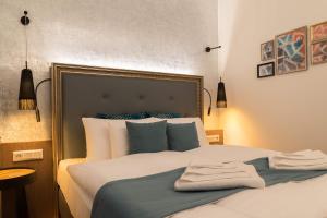 Letto o letti in una camera di Hotel Memories Budapest