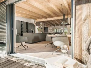 a kitchen and living room with a table and chairs at Postresidenz in Mayrhofen