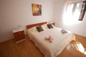 Posteľ alebo postele v izbe v ubytovaní Apartments Daidzic by El-Pi Tours